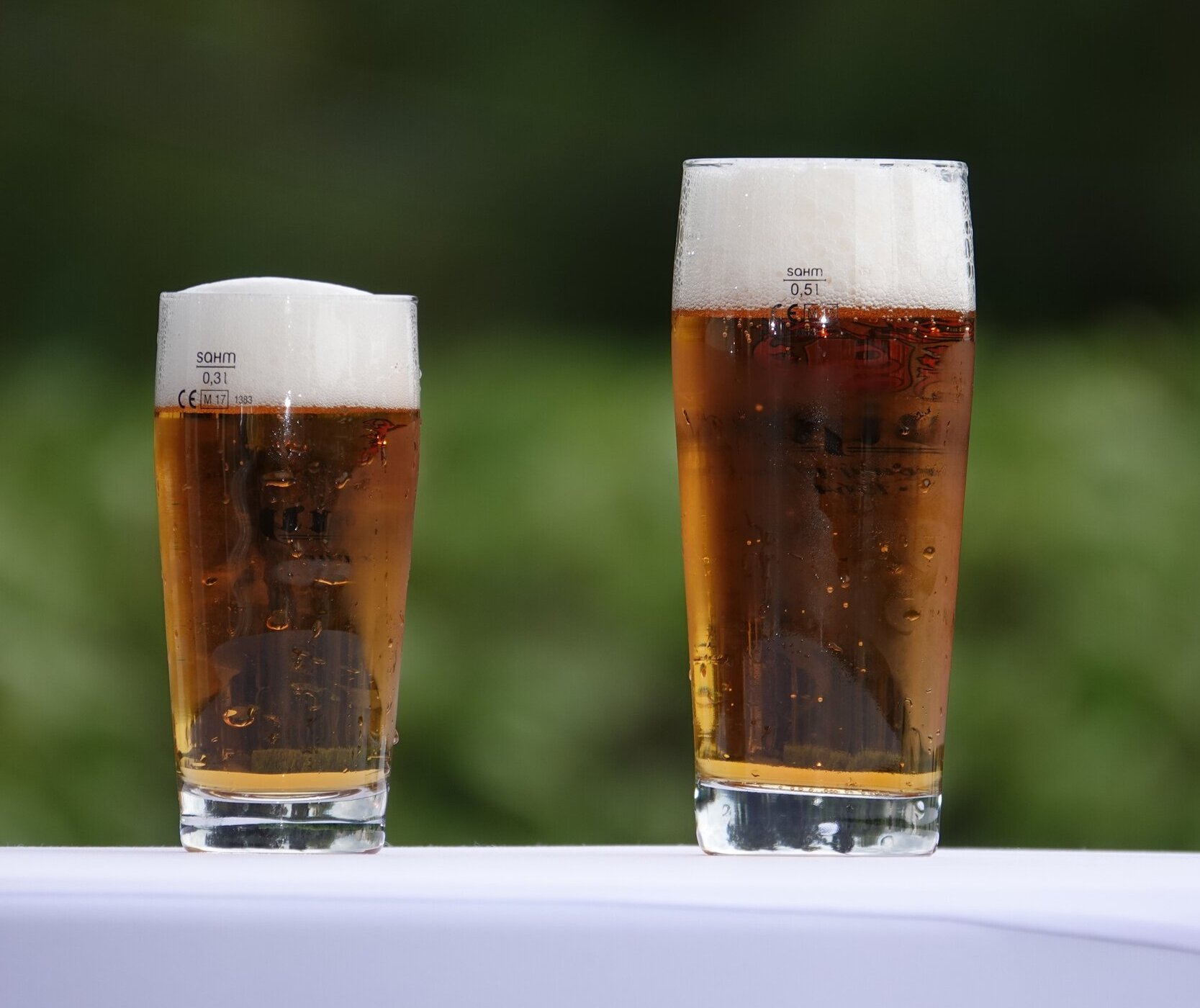 two glasses of beer outside