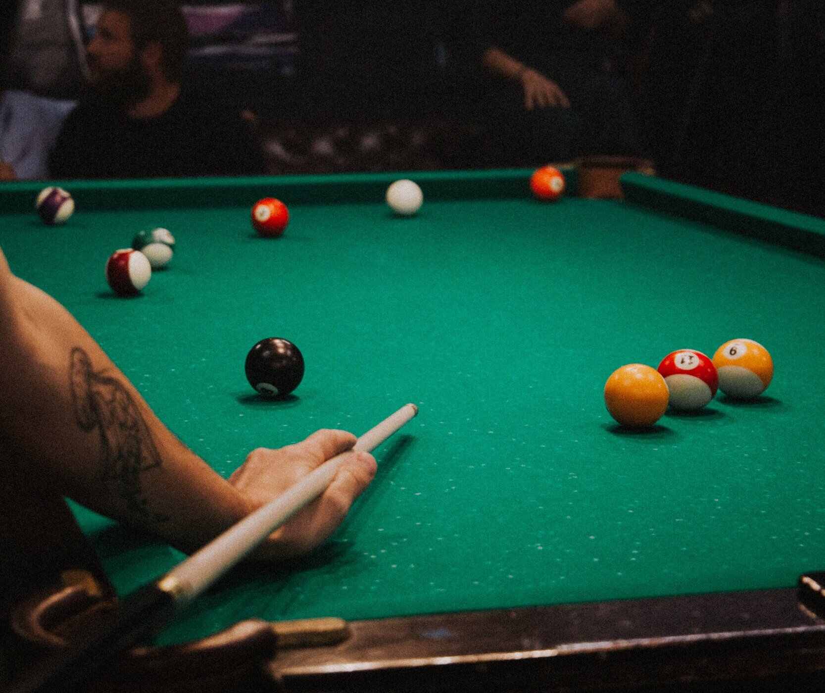 people playing billiards